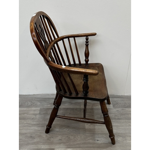 104 - A 19th century elm and ash Windsor armchair - approx. 88cm high x 63cm wide x 54cm deep
