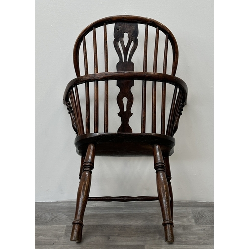 104 - A 19th century elm and ash Windsor armchair - approx. 88cm high x 63cm wide x 54cm deep