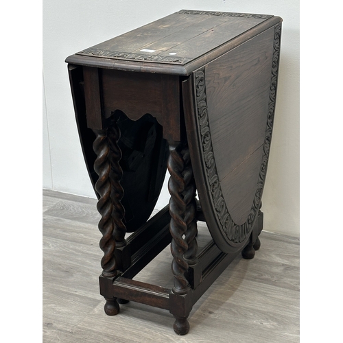 105 - An early 20th century carved oak oval drop leaf gate leg barley twist occasional table - approx. 77c... 
