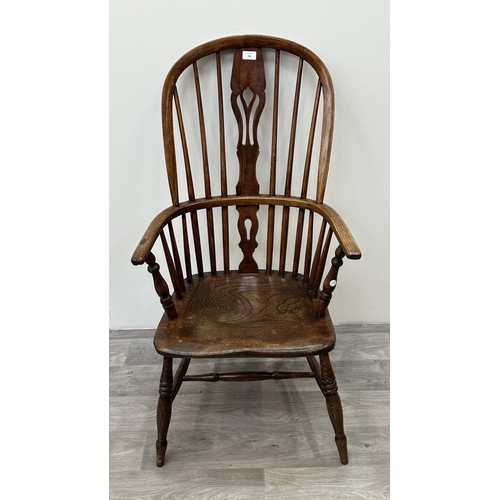 106 - A 19th century elm, ash and beech Windsor armchair - approx. 108cm high