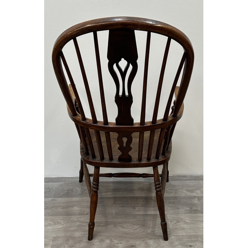106 - A 19th century elm, ash and beech Windsor armchair - approx. 108cm high