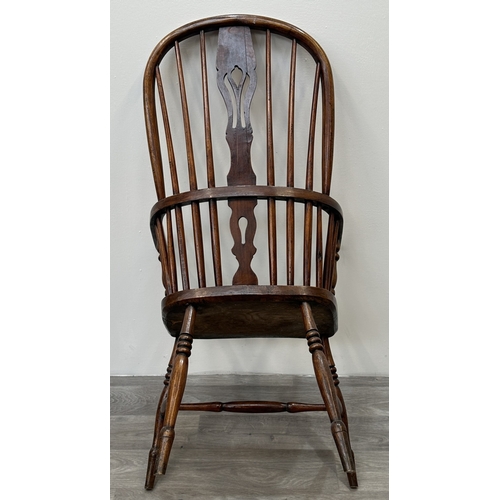 106 - A 19th century elm, ash and beech Windsor armchair - approx. 108cm high