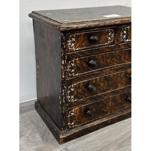 107A - A late 19th/early 20th century brown lacquered and hand painted wooden miniature apprentice piece ch... 