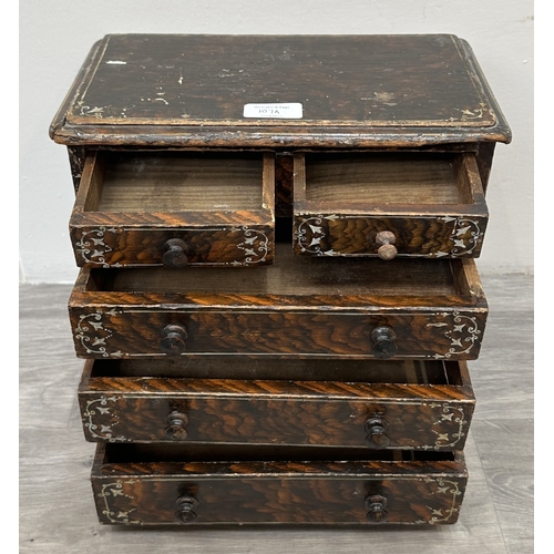 107A - A late 19th/early 20th century brown lacquered and hand painted wooden miniature apprentice piece ch... 