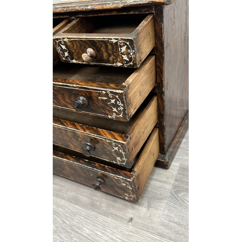 107A - A late 19th/early 20th century brown lacquered and hand painted wooden miniature apprentice piece ch... 