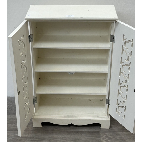 111 - A modern white painted two door cabinet with foliate design - approx. 68.5cm high x 45cm wide x 19cm... 