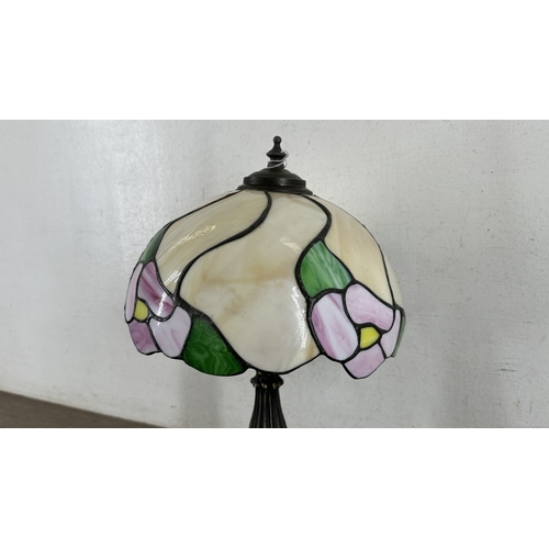 115 - A Tiffany style stained glass and bronzed cast metal table lamp - approx. 37cm high
