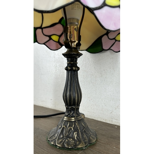 115 - A Tiffany style stained glass and bronzed cast metal table lamp - approx. 37cm high