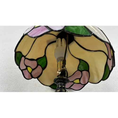 115 - A Tiffany style stained glass and bronzed cast metal table lamp - approx. 37cm high