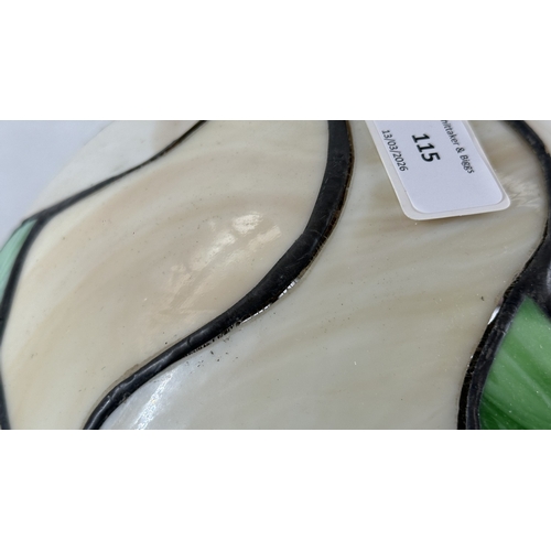 115 - A Tiffany style stained glass and bronzed cast metal table lamp - approx. 37cm high