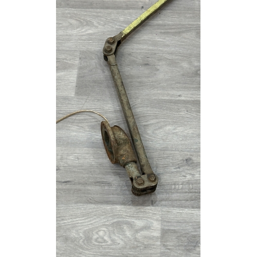 119 - A mid 20th century Mek-Elek green and grey painted metal articulated industrial machinist's desk lam... 