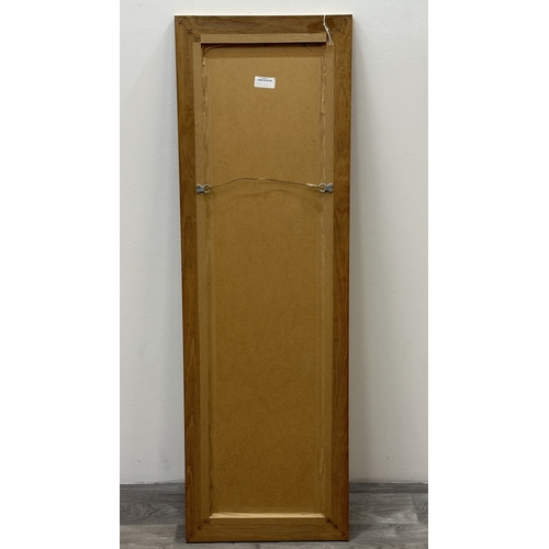 124 - A modern oak framed bevelled edge wall mirror - approx. 135cm high x 43cm wide