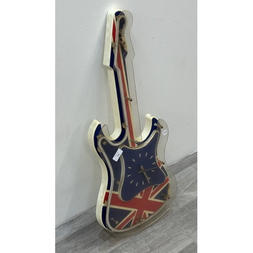 126 - A plastic Union Jack neon guitar wall clock - approx. 74cm long