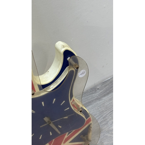 126 - A plastic Union Jack neon guitar wall clock - approx. 74cm long