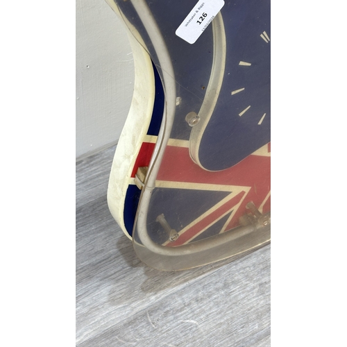 126 - A plastic Union Jack neon guitar wall clock - approx. 74cm long