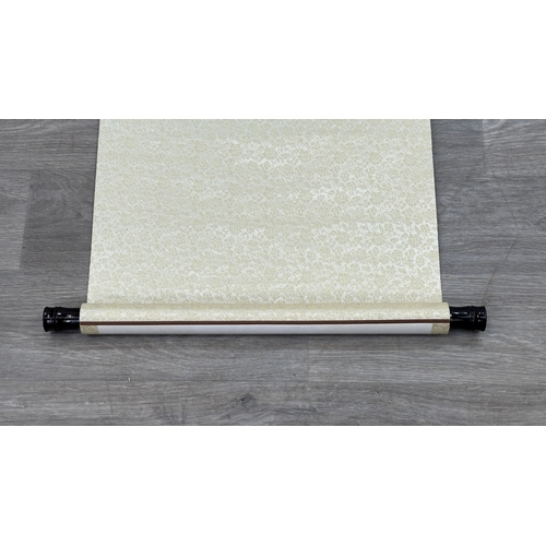 129 - A boxed Chinese calligraphy hanging scroll - approx. 163cm high x 53cm wide