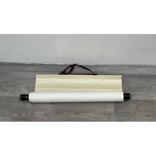 129 - A boxed Chinese calligraphy hanging scroll - approx. 163cm high x 53cm wide