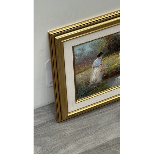 135 - A mid/late 20th century gilt framed oil on canvas of a flower picking scene, signed lower right - ap... 