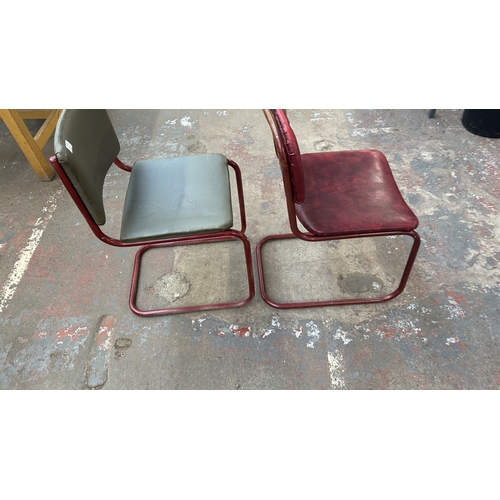 13A - Two mid 20th century red painted tubular metal and vinyl upholstered dining chairs to include one br... 