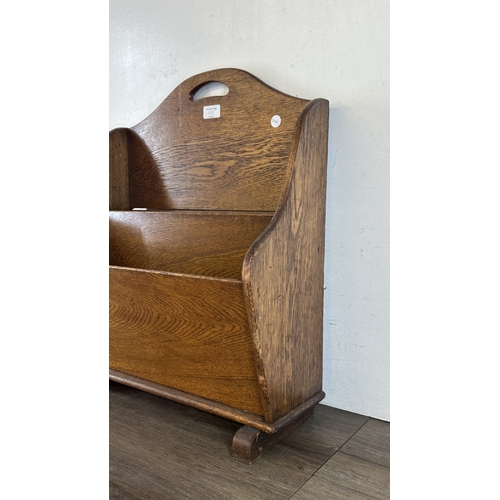 13G - An early 20th century oak two section newspaper stand - approx. 58cm high x 46cm wide x 21cm deep