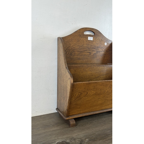 13G - An early 20th century oak two section newspaper stand - approx. 58cm high x 46cm wide x 21cm deep