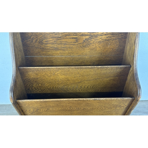 13G - An early 20th century oak two section newspaper stand - approx. 58cm high x 46cm wide x 21cm deep