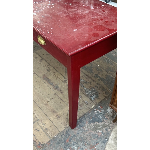 13H - A mid 20th century red painted two drawer desk - approx. 76cm high x 122cm wide x 62cm deep
