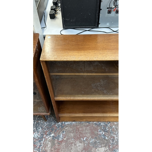 13J - A mid 20th century Herbert E. Gibbs teak bookcase with two glass sliding doors - approx. 84cm high x... 