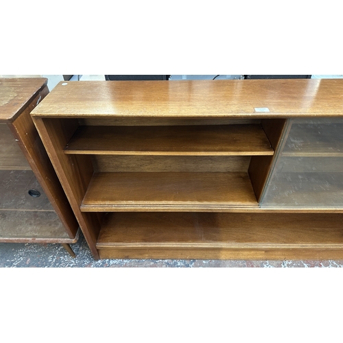 13J - A mid 20th century Herbert E. Gibbs teak bookcase with two glass sliding doors - approx. 84cm high x... 