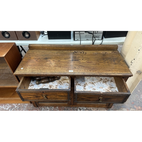 13K - An early 20th century oak sideboard - approx. 76cm high x 107cm wide x 42cm deep