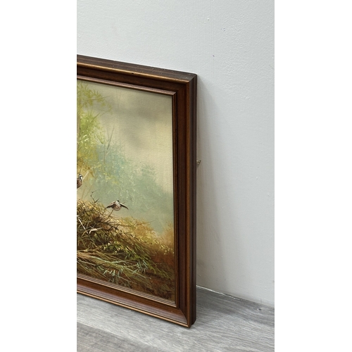 144 - A late 20th century framed oil on canvas of a hunting dog scene, signed L. Eiford - approx. 58cm hig... 