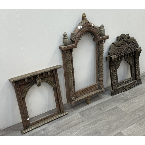 148 - Three Indian painted and carved wooden jharoka window frames - largest approx. 94cm high x 55cm wide