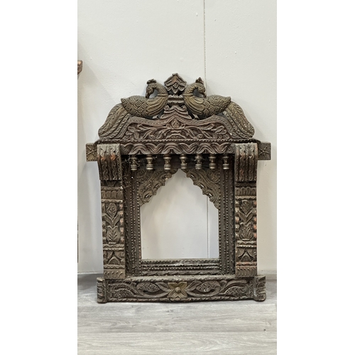 148 - Three Indian painted and carved wooden jharoka window frames - largest approx. 94cm high x 55cm wide