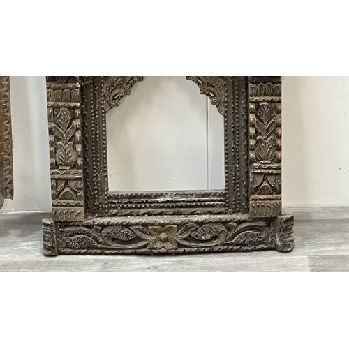 148 - Three Indian painted and carved wooden jharoka window frames - largest approx. 94cm high x 55cm wide