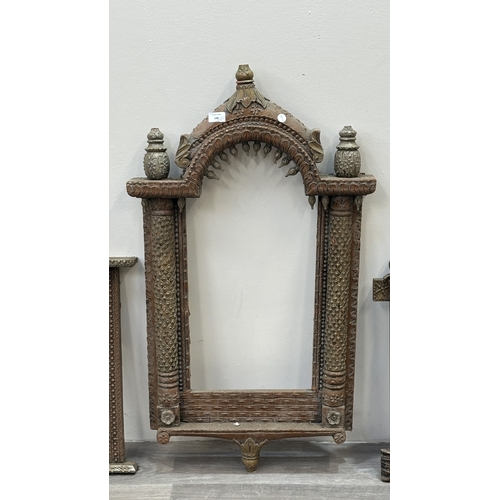 148 - Three Indian painted and carved wooden jharoka window frames - largest approx. 94cm high x 55cm wide