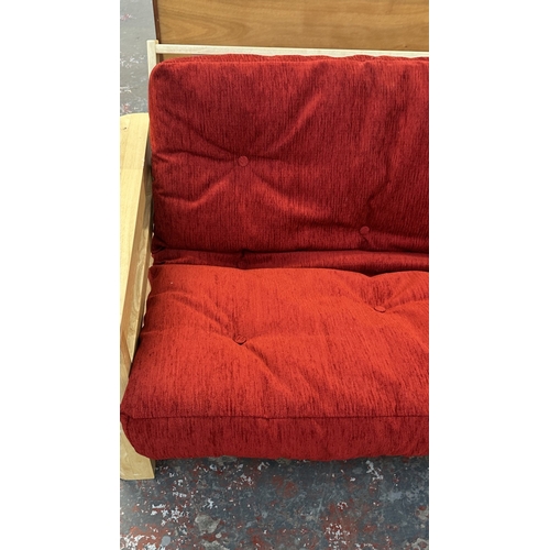 15 - A modern beech sofa bed with Kyoto Futons Ltd. red fabric upholstered cushion - approx. 82cm high x ... 