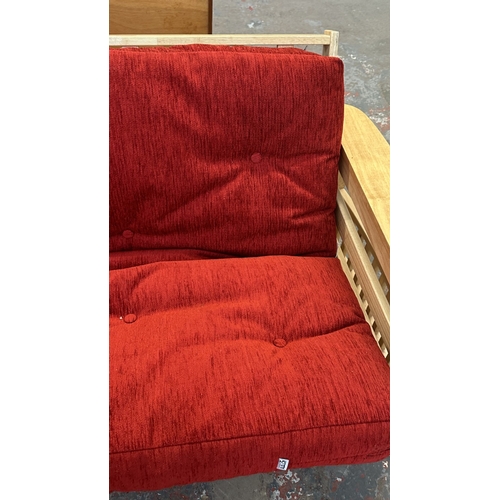 15 - A modern beech sofa bed with Kyoto Futons Ltd. red fabric upholstered cushion - approx. 82cm high x ... 