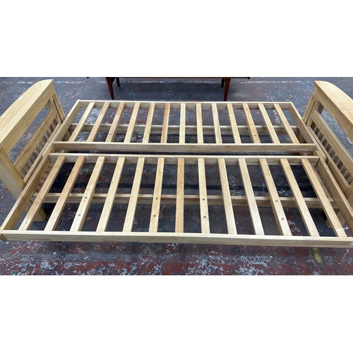 15 - A modern beech sofa bed with Kyoto Futons Ltd. red fabric upholstered cushion - approx. 82cm high x ... 