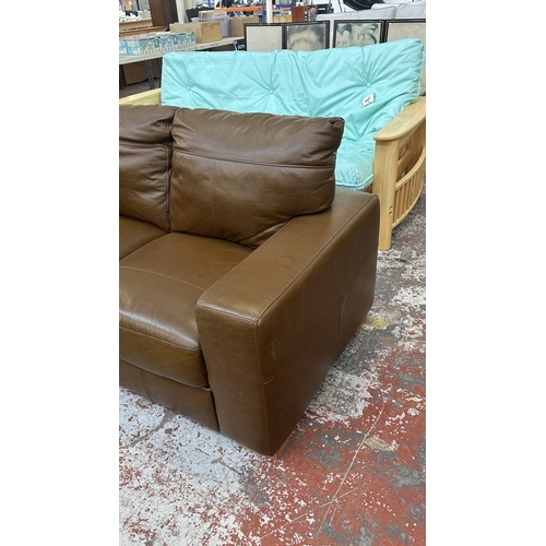 19 - A modern brown leather two seater sofa - approx. 88cm high x 152cm wide x 85cm deep