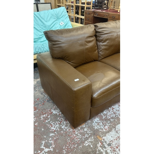 19 - A modern brown leather two seater sofa - approx. 88cm high x 152cm wide x 85cm deep