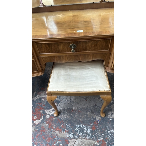 25 - A mid 20th century Heathland Furniture walnut dressing table and stool - approx. 157cm high includin... 