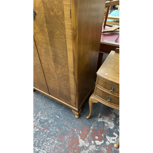 26 - A mid 20th century Heathland Furniture walnut double wardrobe - approx. 192cm high x 95cm wide x 55c... 