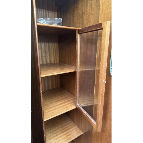 26 - A mid 20th century Heathland Furniture walnut double wardrobe - approx. 192cm high x 95cm wide x 55c... 