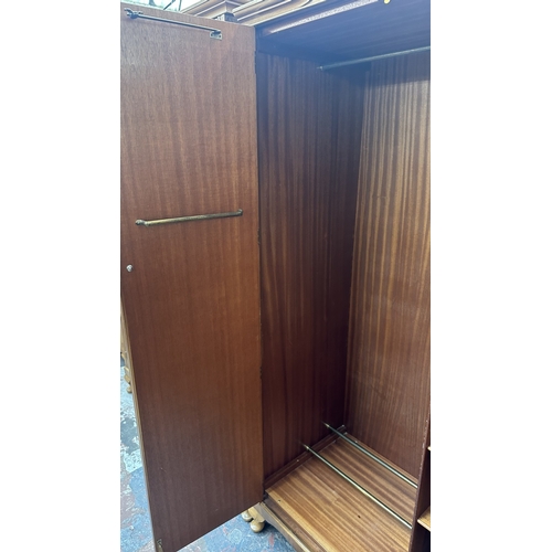 26 - A mid 20th century Heathland Furniture walnut double wardrobe - approx. 192cm high x 95cm wide x 55c... 