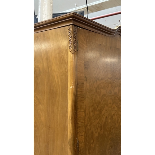 27 - A mid 20th century Heathland Furniture walnut double wardrobe - approx. 198cm high x 125cm wide x 55... 