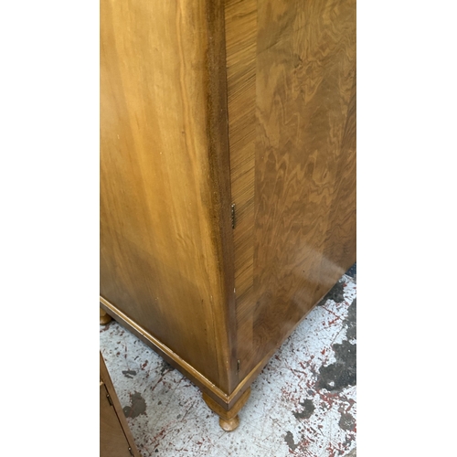 27 - A mid 20th century Heathland Furniture walnut double wardrobe - approx. 198cm high x 125cm wide x 55... 