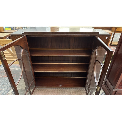 33 - An early 20th century mahogany display cabinet - approx. 116cm high x 121cm wide x 33cm deep