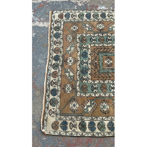 37B - A mid/late 20th century Turkish hand knotted rug - approx. 198cm x 128cm