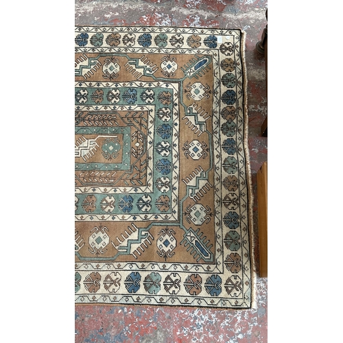 37B - A mid/late 20th century Turkish hand knotted rug - approx. 198cm x 128cm