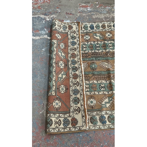 37B - A mid/late 20th century Turkish hand knotted rug - approx. 198cm x 128cm